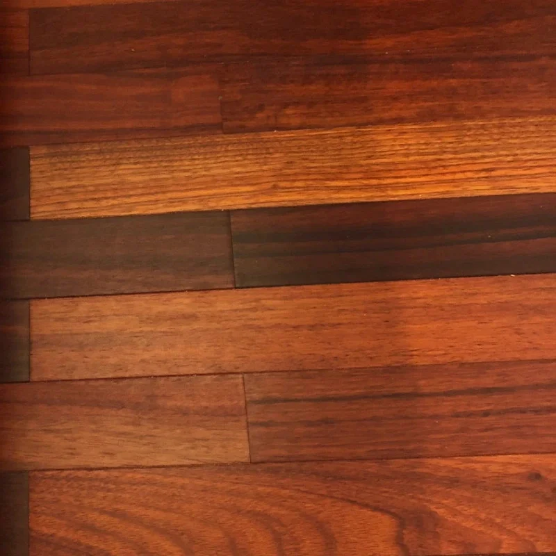 Parquet massif Padouk brut — lames larges — teinte exotique cuivrée